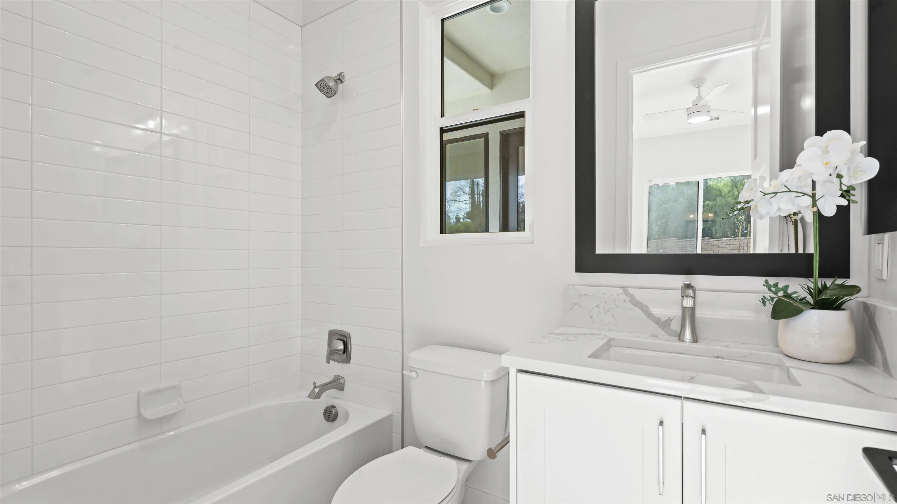 16925 Old Coach Road Poway, CA 92064 - Photo 40 of 53 a bathroom with a granite countertop sink a toilet a mirror and shower