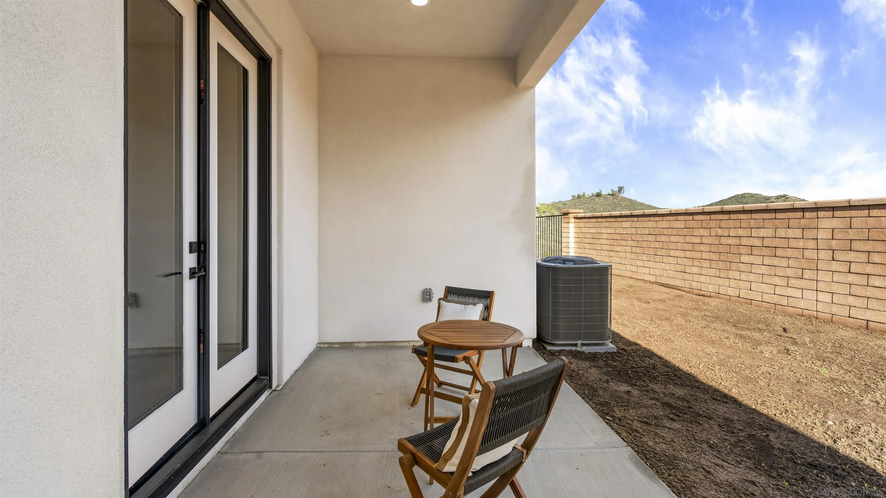 16925 Old Coach Road Poway, CA 92064 - Photo 48 of 53 a view of a balcony with chair and table