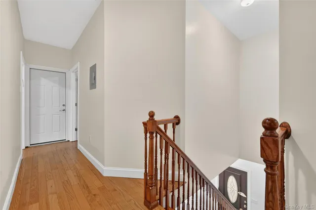 a view of staircase with lots of furniture and rug