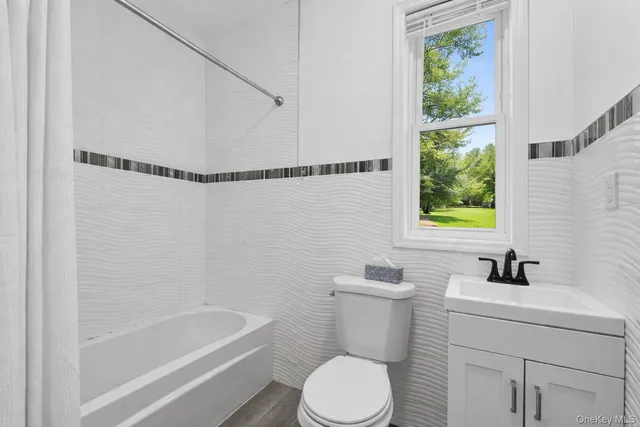 a view of a balcony with wooden floor