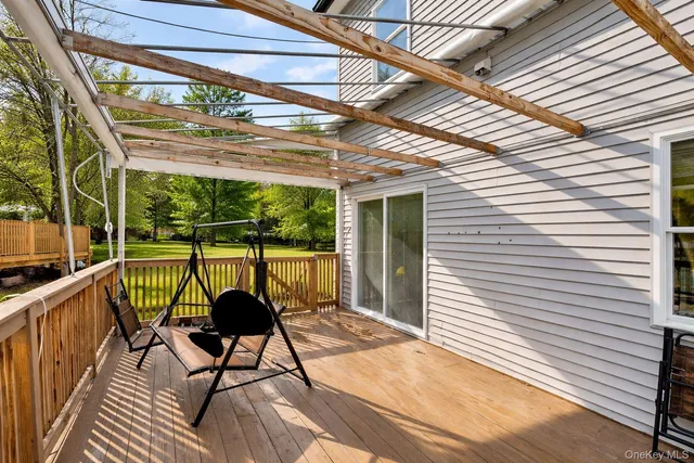 a view of a room with wooden floor and furniture