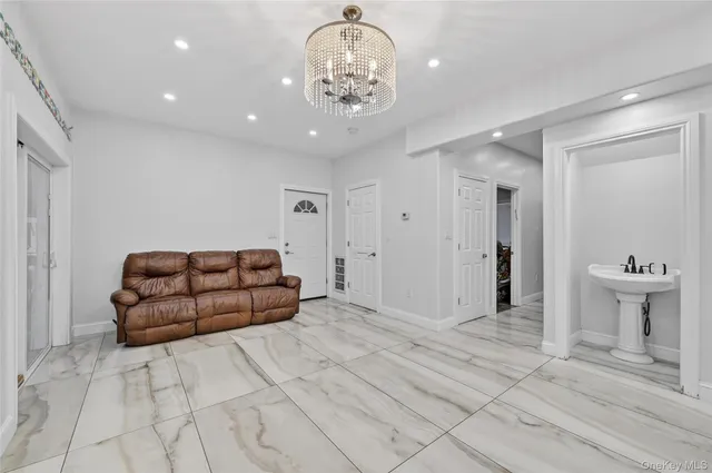 a white toilet sitting next to a white sink