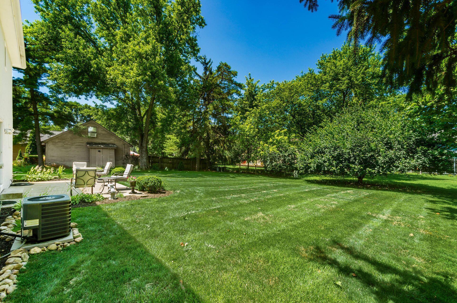 7771 Strathmoore Road Dublin, OH 43016 - Photo 29 of 32 Open views of the backyard & concrete patio.