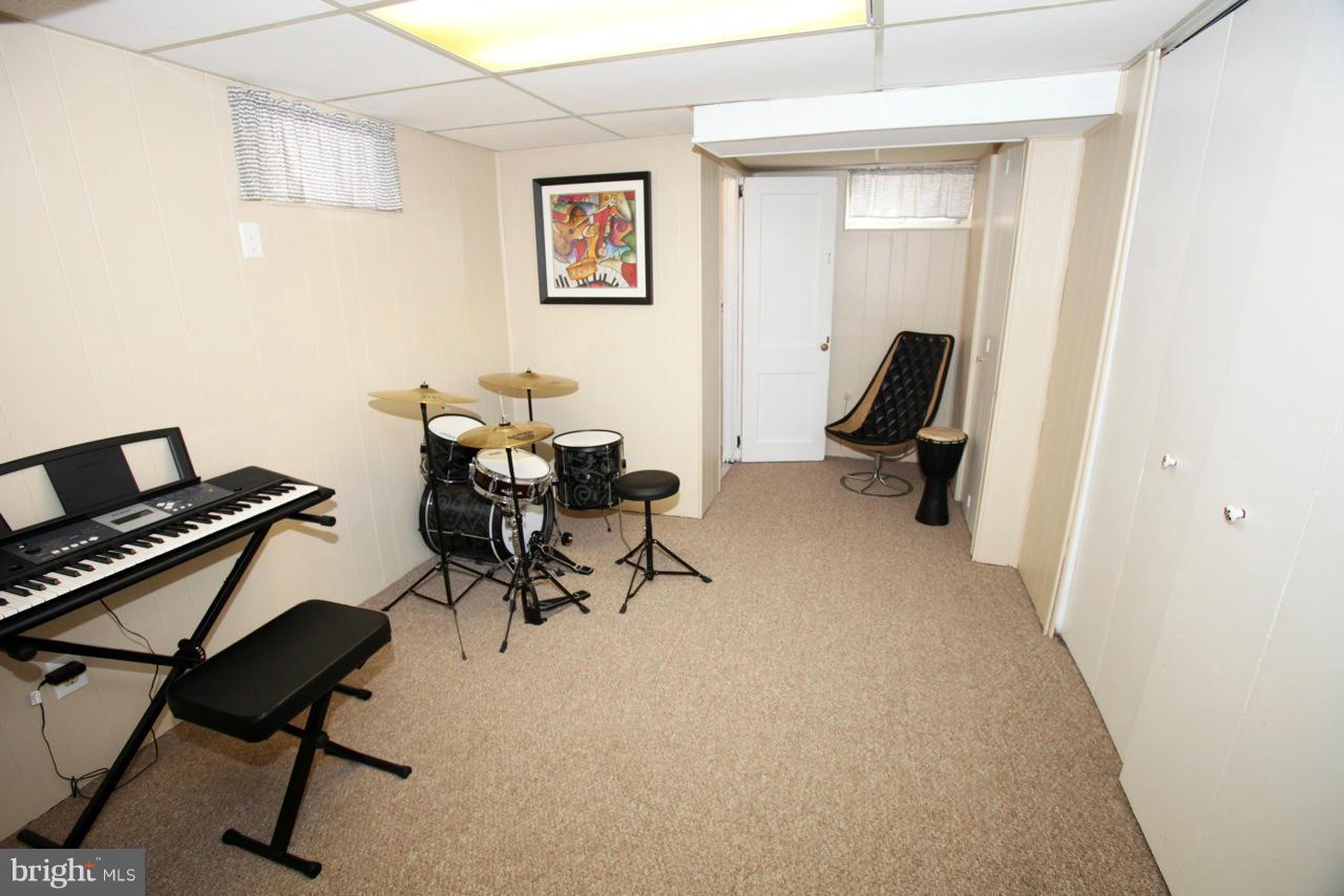 211 Gaywood Road Baltimore, MD 21212 - Photo 22 of 27 a view of a workspace with furniture and a window