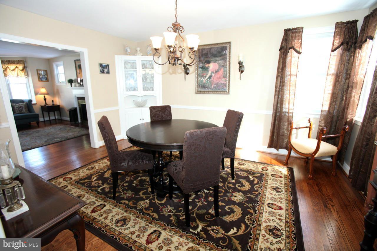 211 Gaywood Road Baltimore, MD 21212 - Photo 8 of 27 a view of a dining room with furniture window and wooden floor