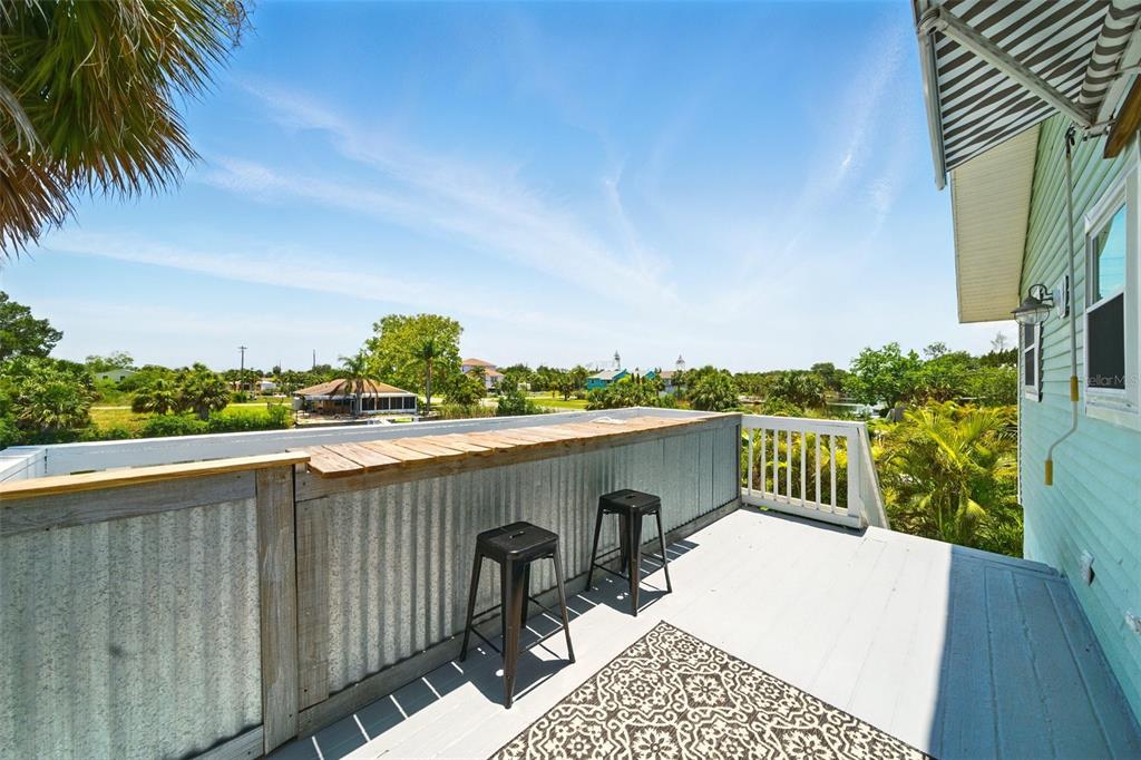3312 Holly Springs Drive Hernando Beach, FL 34607 - Photo 24 of 42 a view of a terrace with a bench
