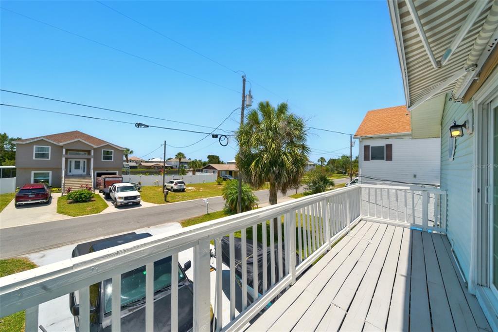 3312 Holly Springs Drive Hernando Beach, FL 34607 - Photo 27 of 42 a view of a balcony with cars parked on the road