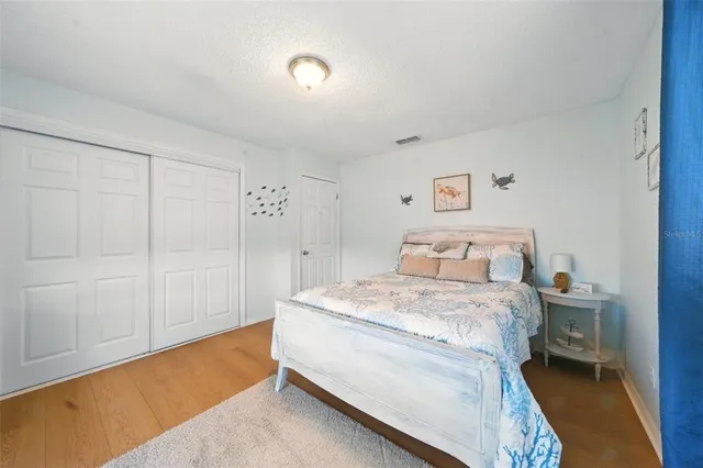 a room with a bed and a closet