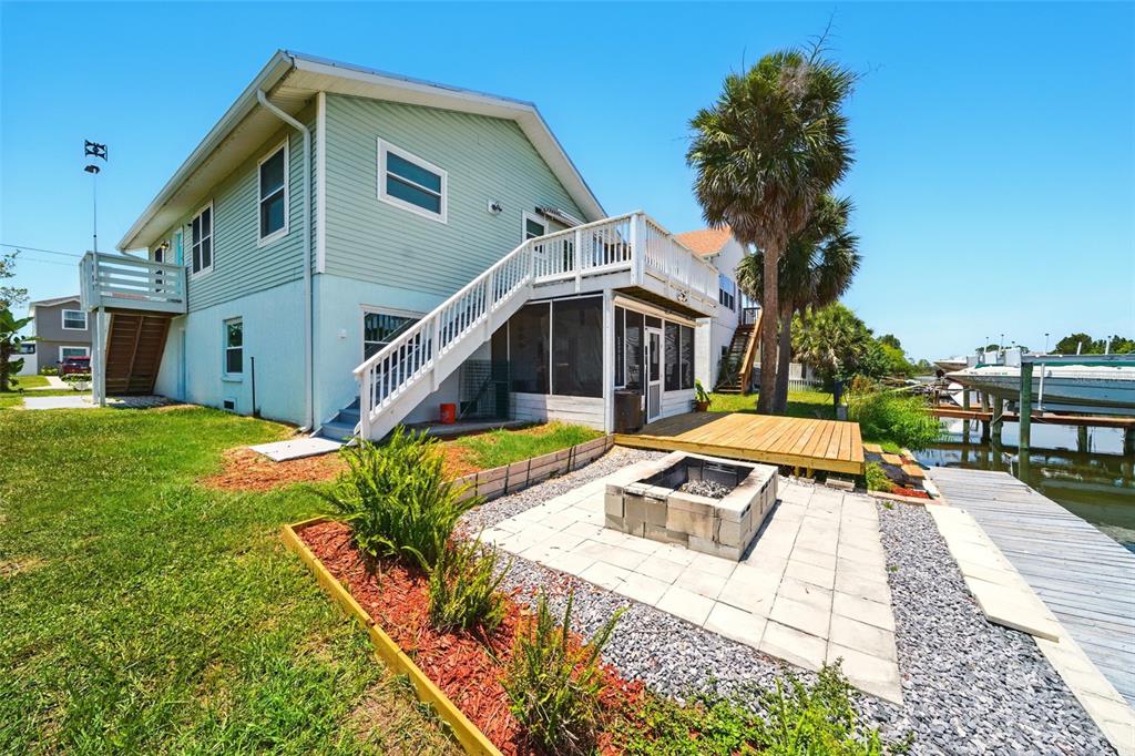 3312 Holly Springs Drive Hernando Beach, FL 34607 - Photo 4 of 42 a view of a house with pool and sitting area
