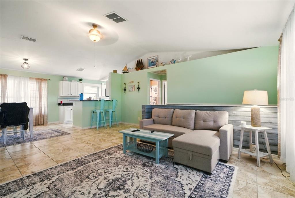 3312 Holly Springs Drive Hernando Beach, FL 34607 - Photo 8 of 42 a living room with furniture and a kitchen view