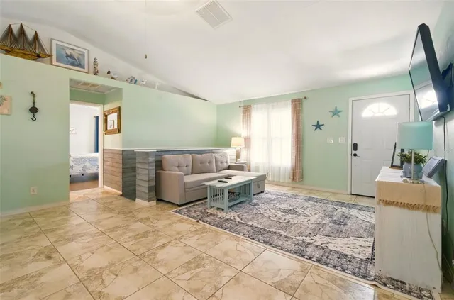 a living room with furniture and a table