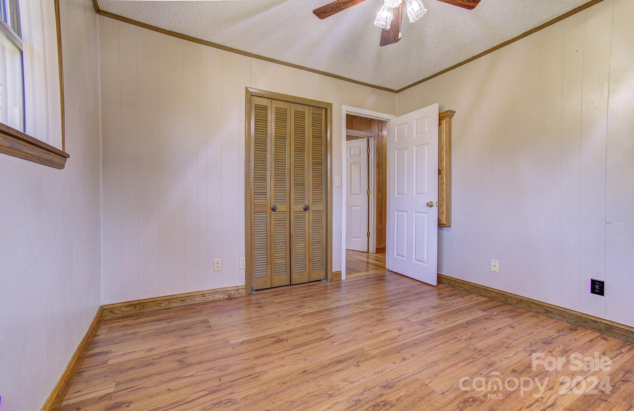 111 Souther Road Fletcher, NC 28732 - Photo 16 of 31 a view of an empty room with a chandelier fan