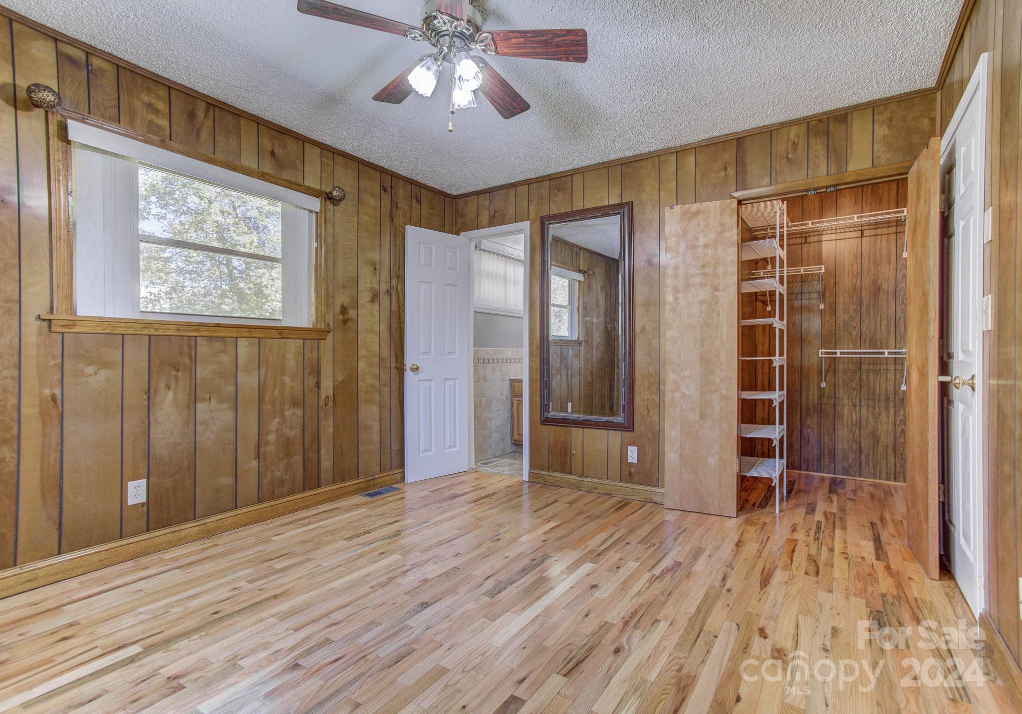111 Souther Road Fletcher, NC 28732 - Photo 18 of 31 wooden floor in an empty room with a window
