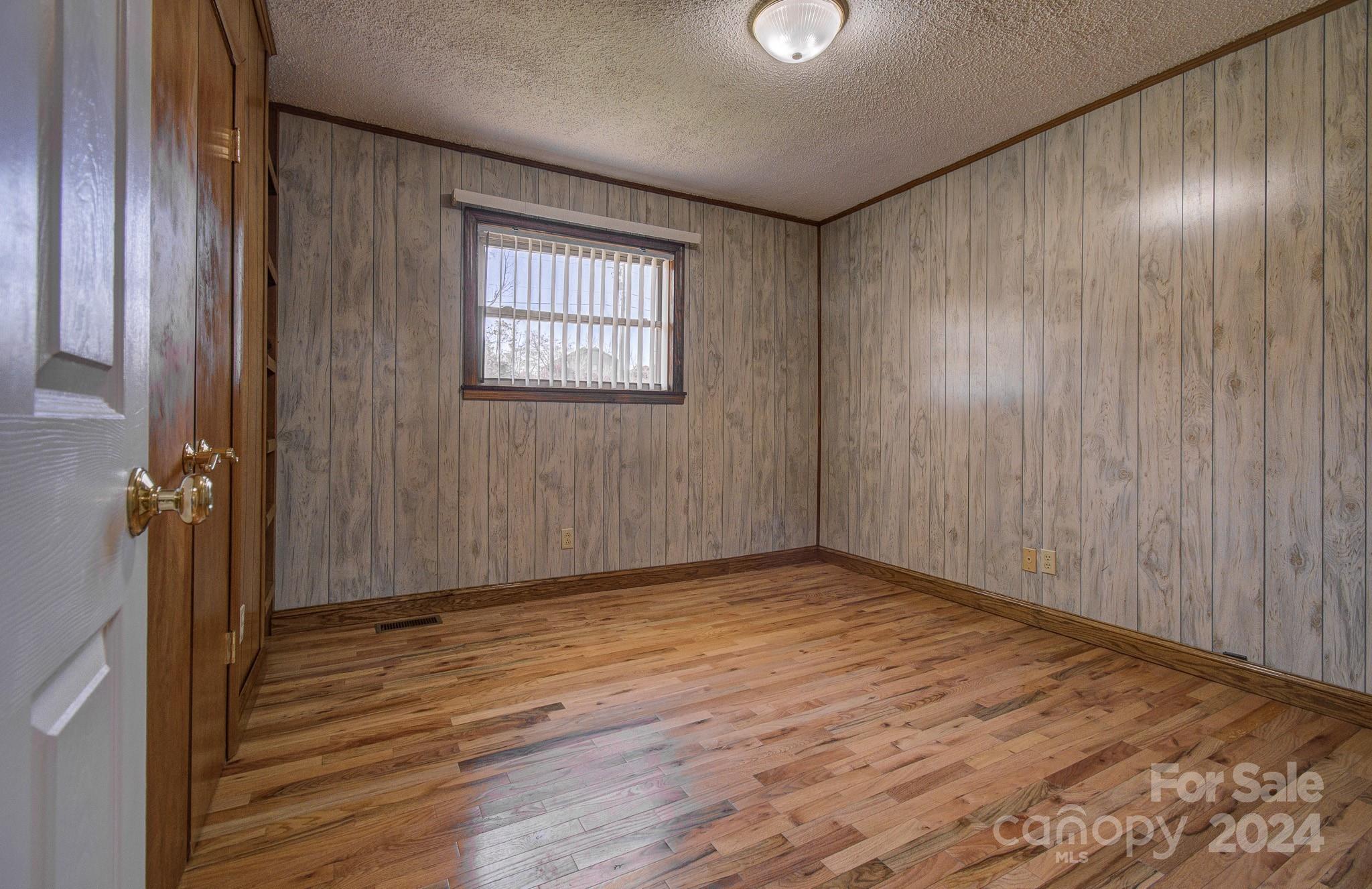 111 Souther Road Fletcher, NC 28732 - Photo 20 of 31 a view of an empty room with wooden floor and a window