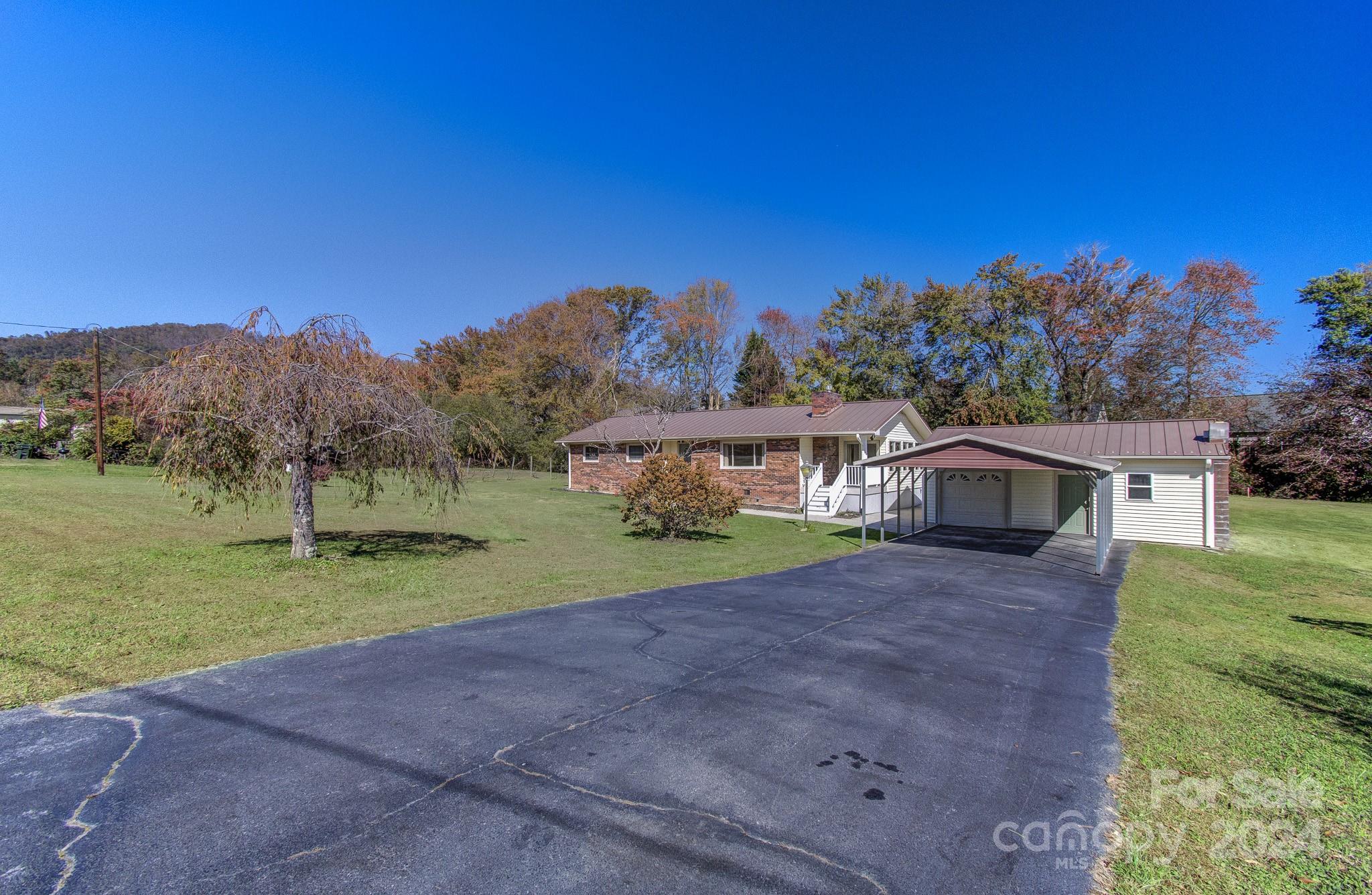111 Souther Road Fletcher, NC 28732 - Photo 25 of 31 a view of a house with a yard