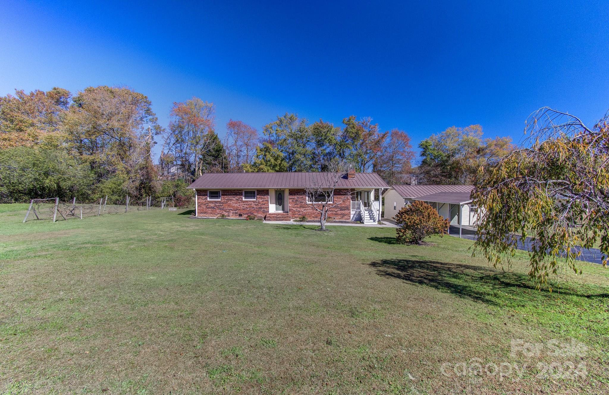 111 Souther Road Fletcher, NC 28732 - Photo 26 of 31 a view of a house with a yard