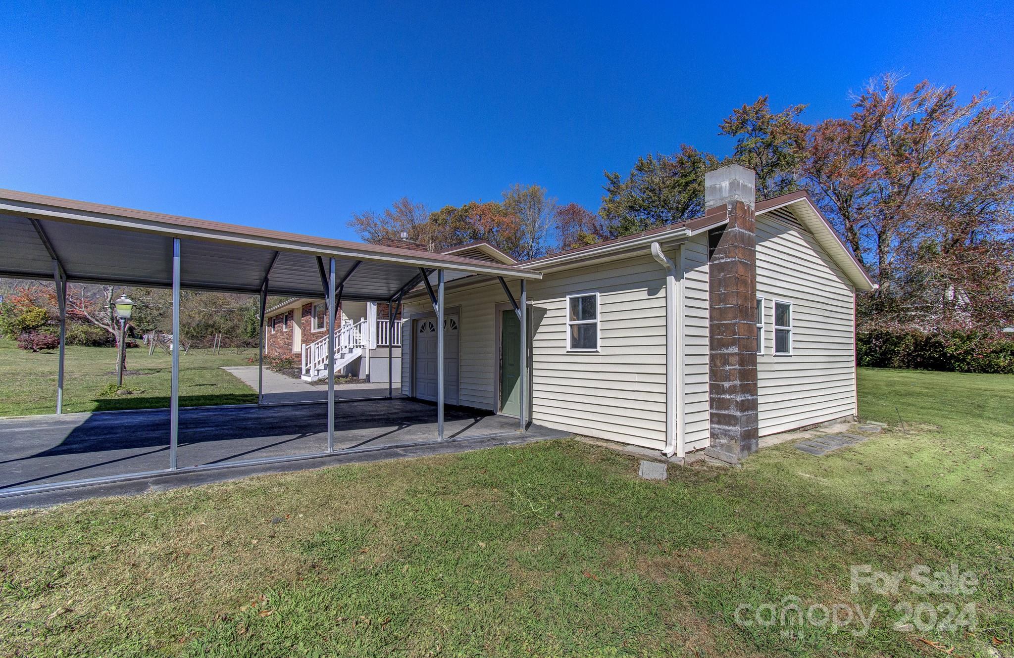 111 Souther Road Fletcher, NC 28732 - Photo 29 of 31 a front view of a house with garden