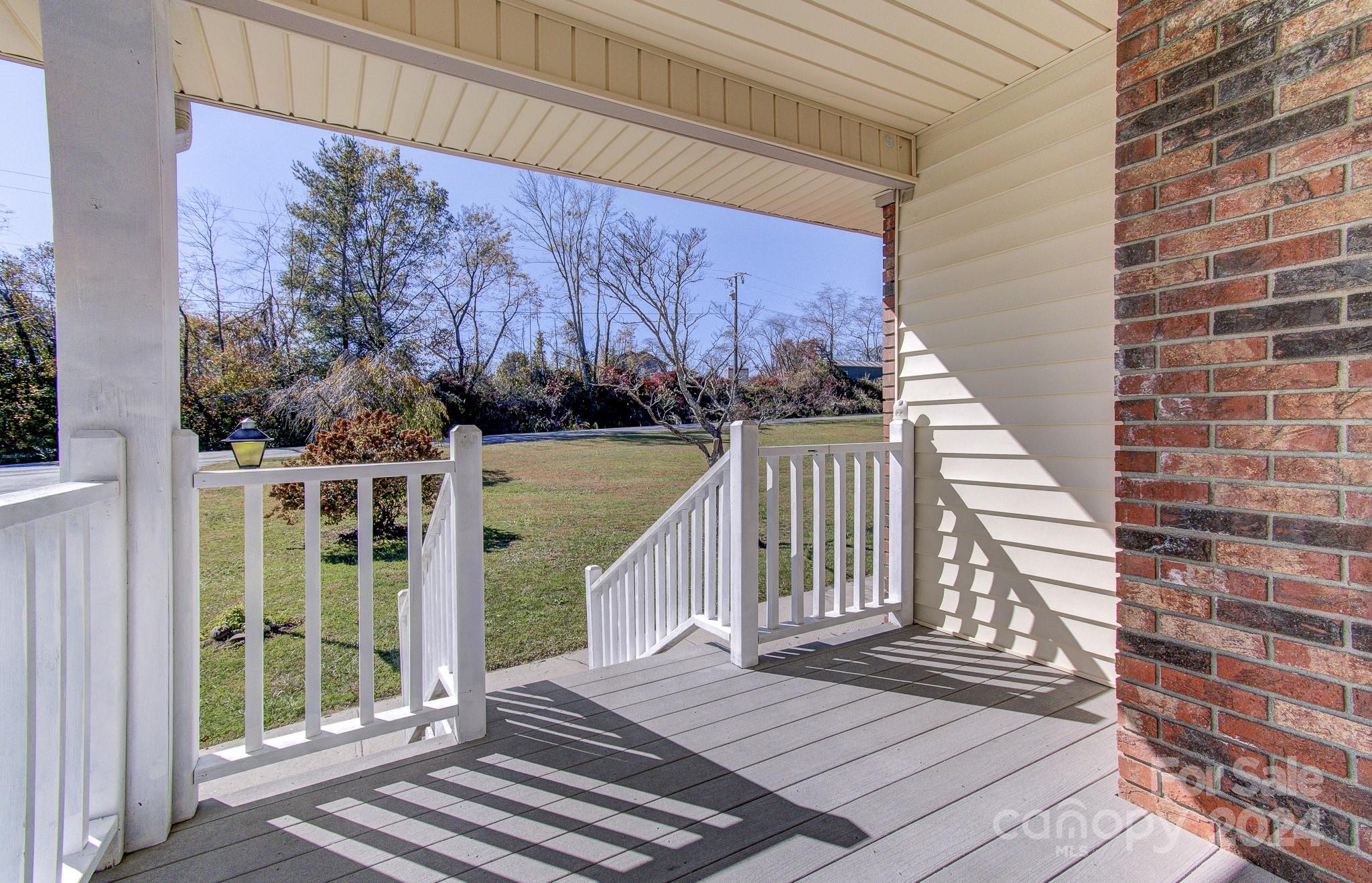 111 Souther Road Fletcher, NC 28732 - Photo 31 of 31 a view of a balcony with wooden floor and fence