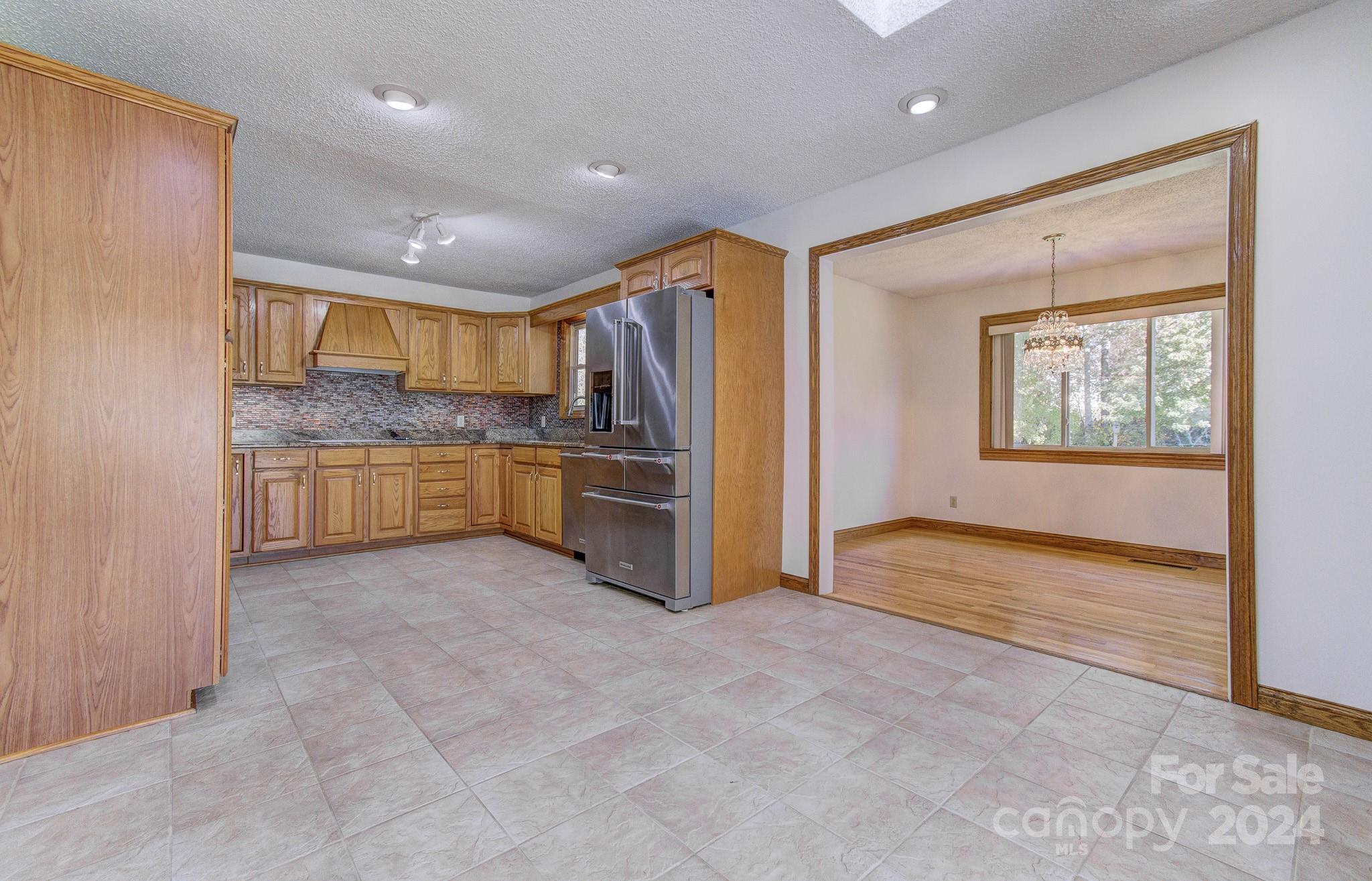 111 Souther Road Fletcher, NC 28732 - Photo 8 of 31 a large kitchen with a stove and a refrigerator