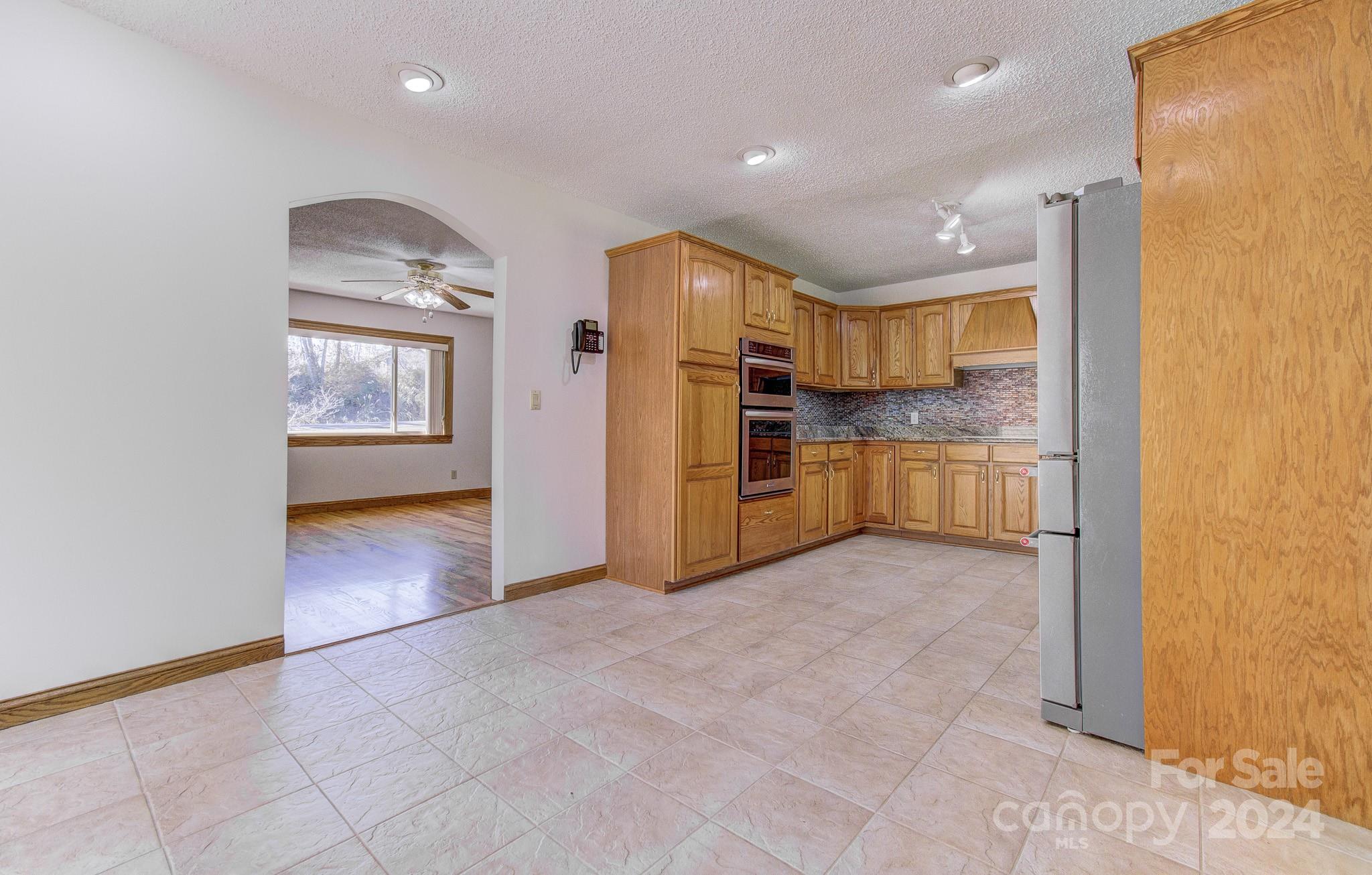 111 Souther Road Fletcher, NC 28732 - Photo 9 of 31 a view of a kitchen with a sink and refrigerator