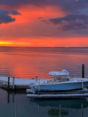 a kitchen with stainless steel appliances granite countertop a sink counter space cabinets and a large window