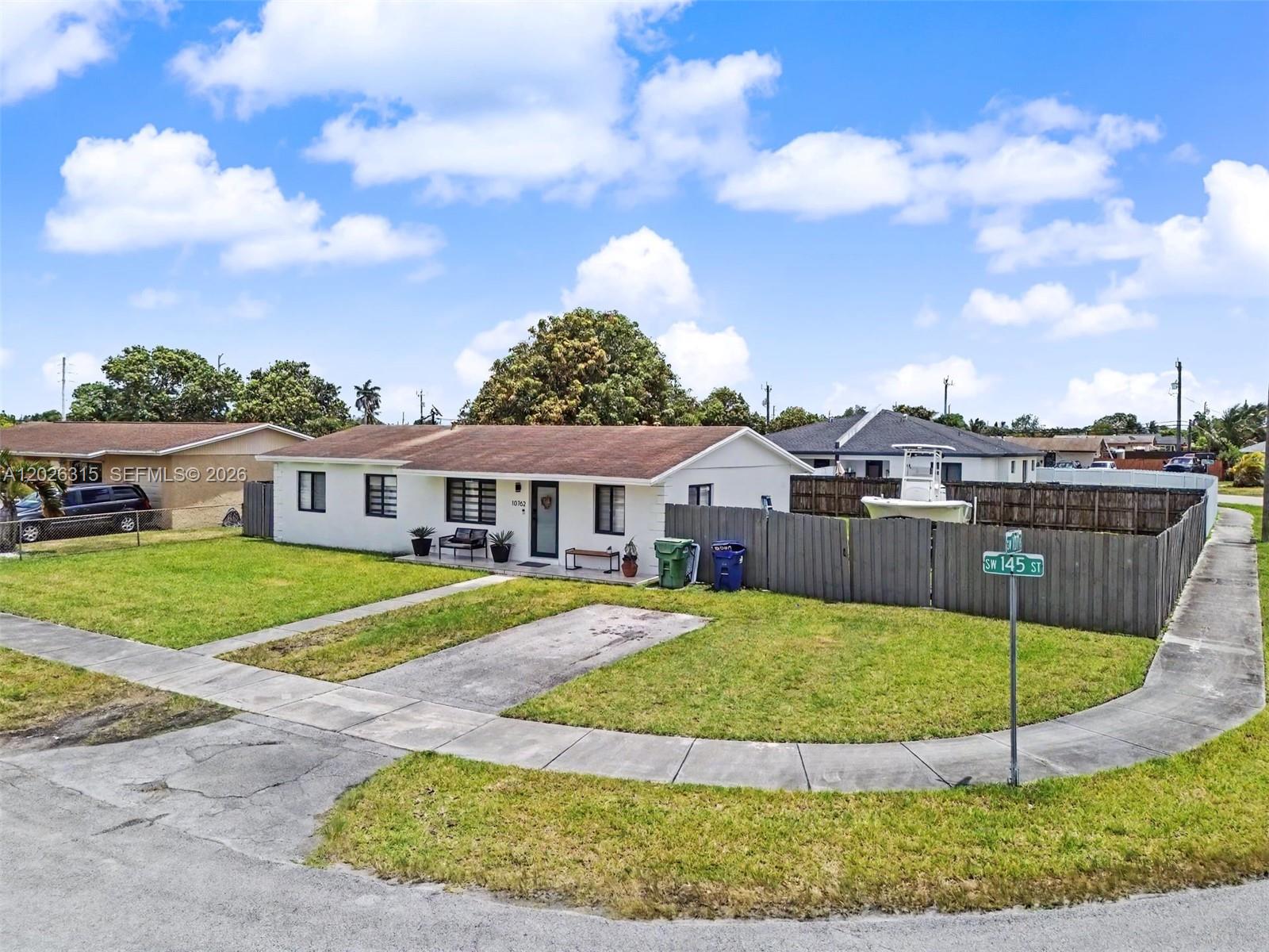 10762 Southwest 145th Street Miami, FL 33176 - Photo 2 of 28 a view of a house with a backyard