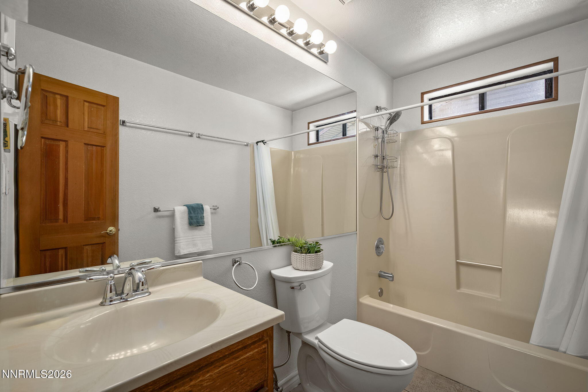 2985 Socrates Drive Reno, NV 89512 - Photo 38 of 52 a bathroom with a sink a toilet and shower