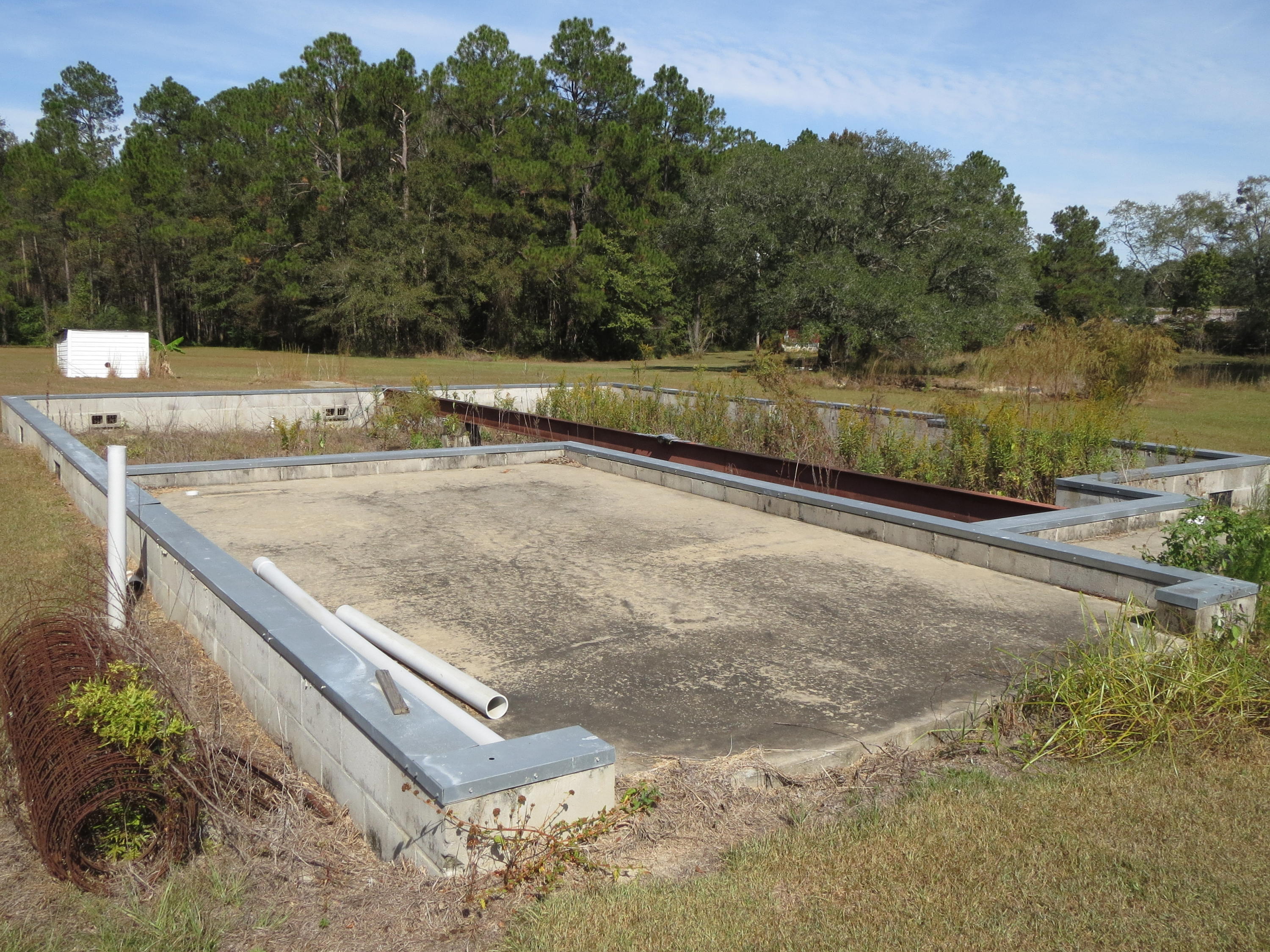 932 Tri County Road Graceville, FL 32440 - Photo 27 of 40 a view of a backyard with a lake view