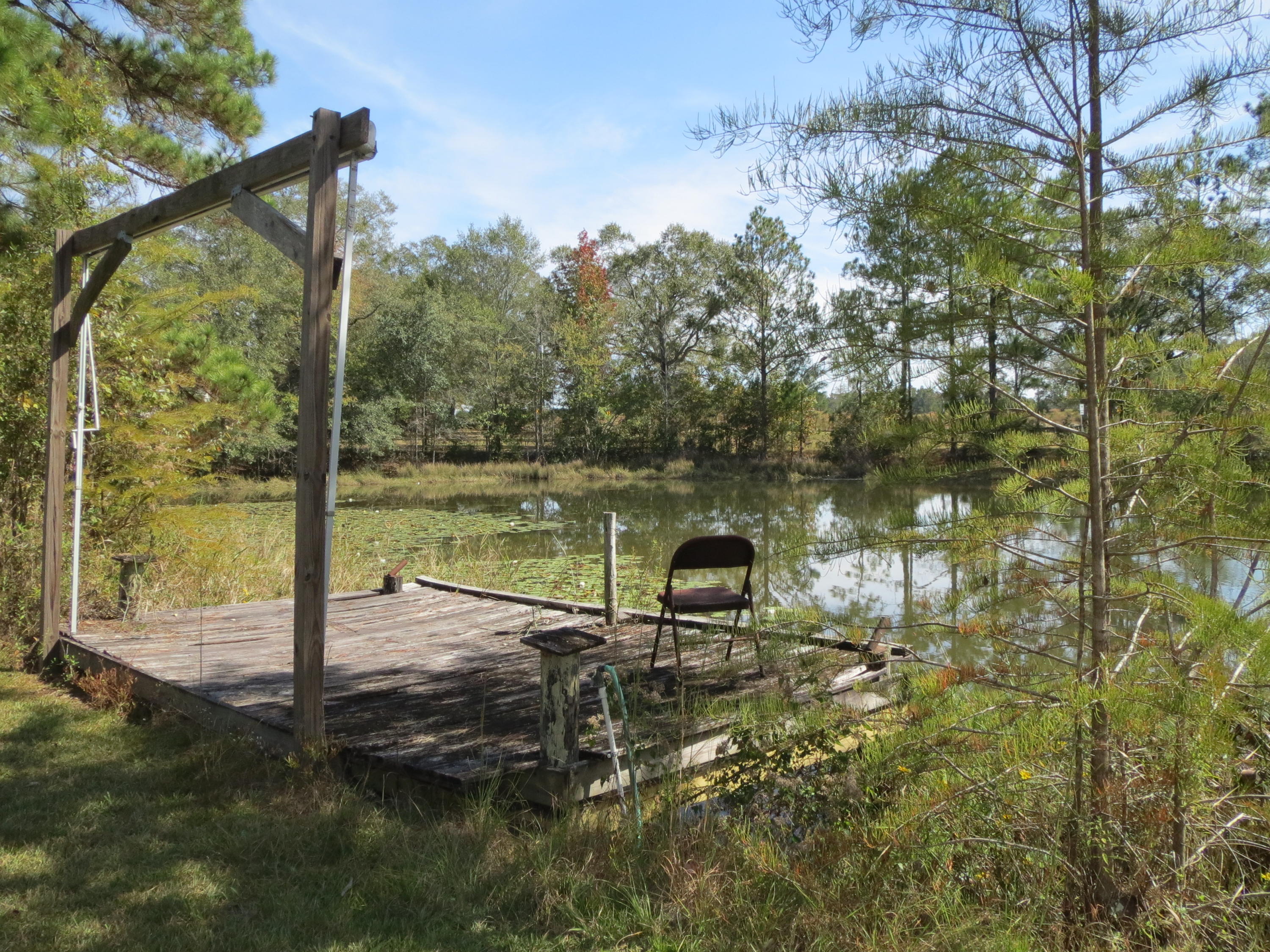 932 Tri County Road Graceville, FL 32440 - Photo 32 of 40 a view of a lake view
