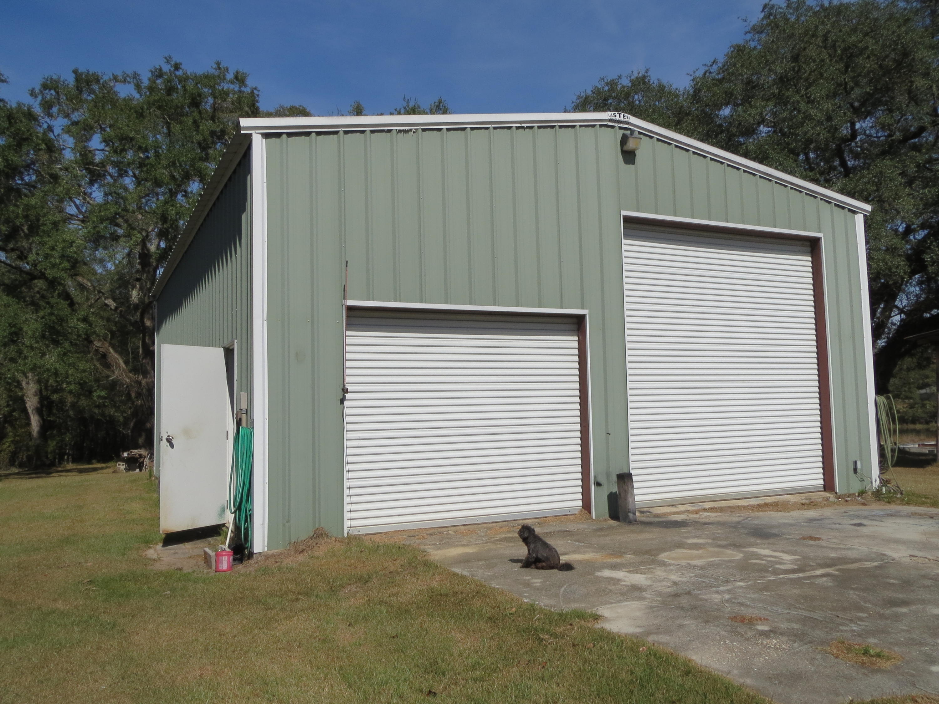 932 Tri County Road Graceville, FL 32440 - Photo 34 of 40 a view of a house with a garage