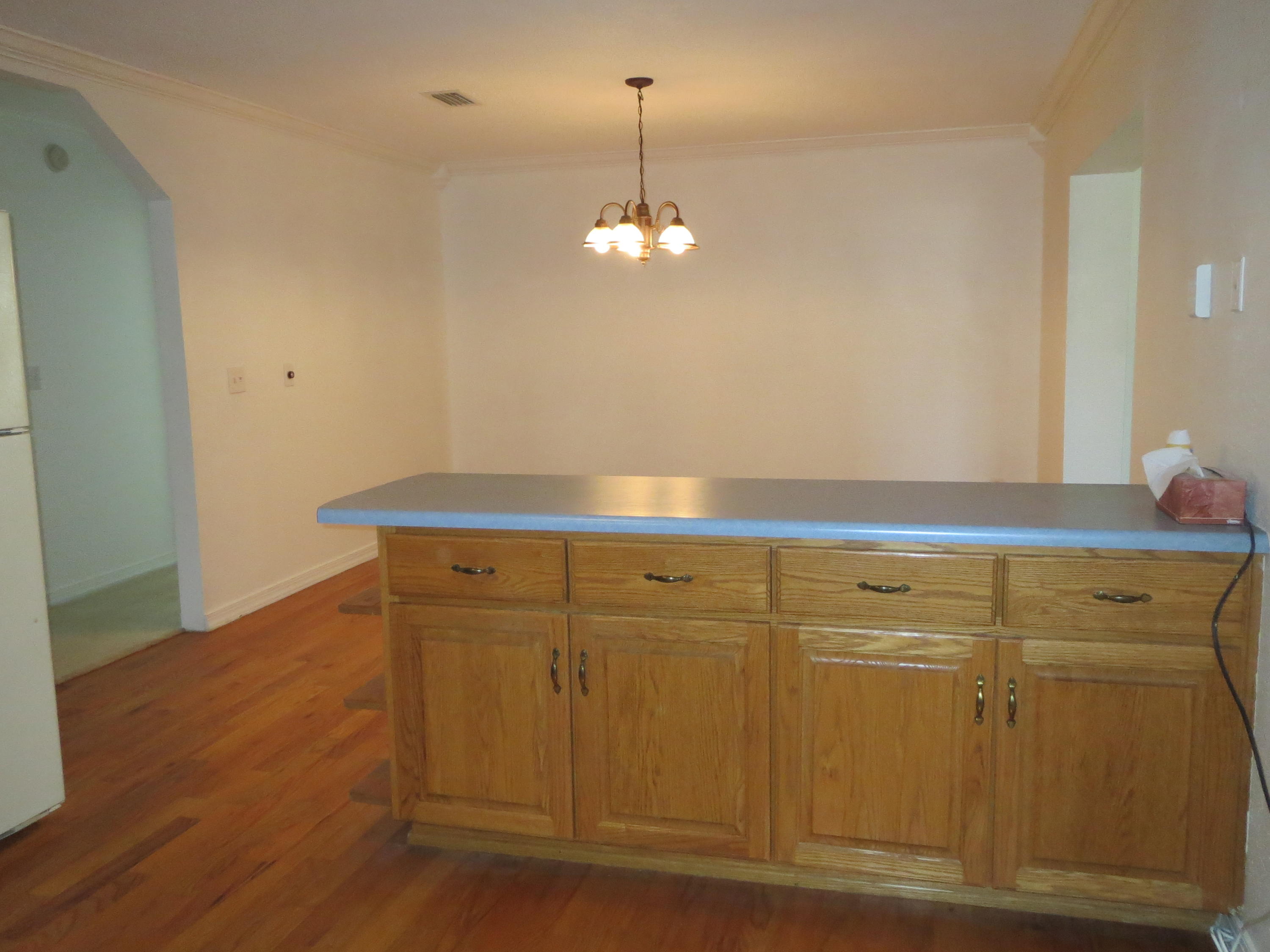 932 Tri County Road Graceville, FL 32440 - Photo 5 of 40 a view of cabinets and wooden floor