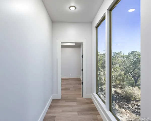 a view of a bathroom from the hallway