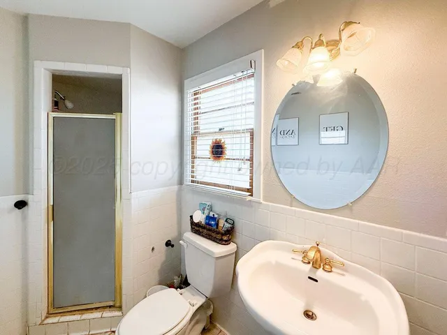a bathroom with a bathtub and a window