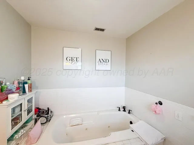 a bathroom with a sink a mirror and a shower