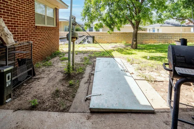 a front view of a house with a yard table and chairs