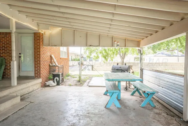 a view of a backyard with large trees