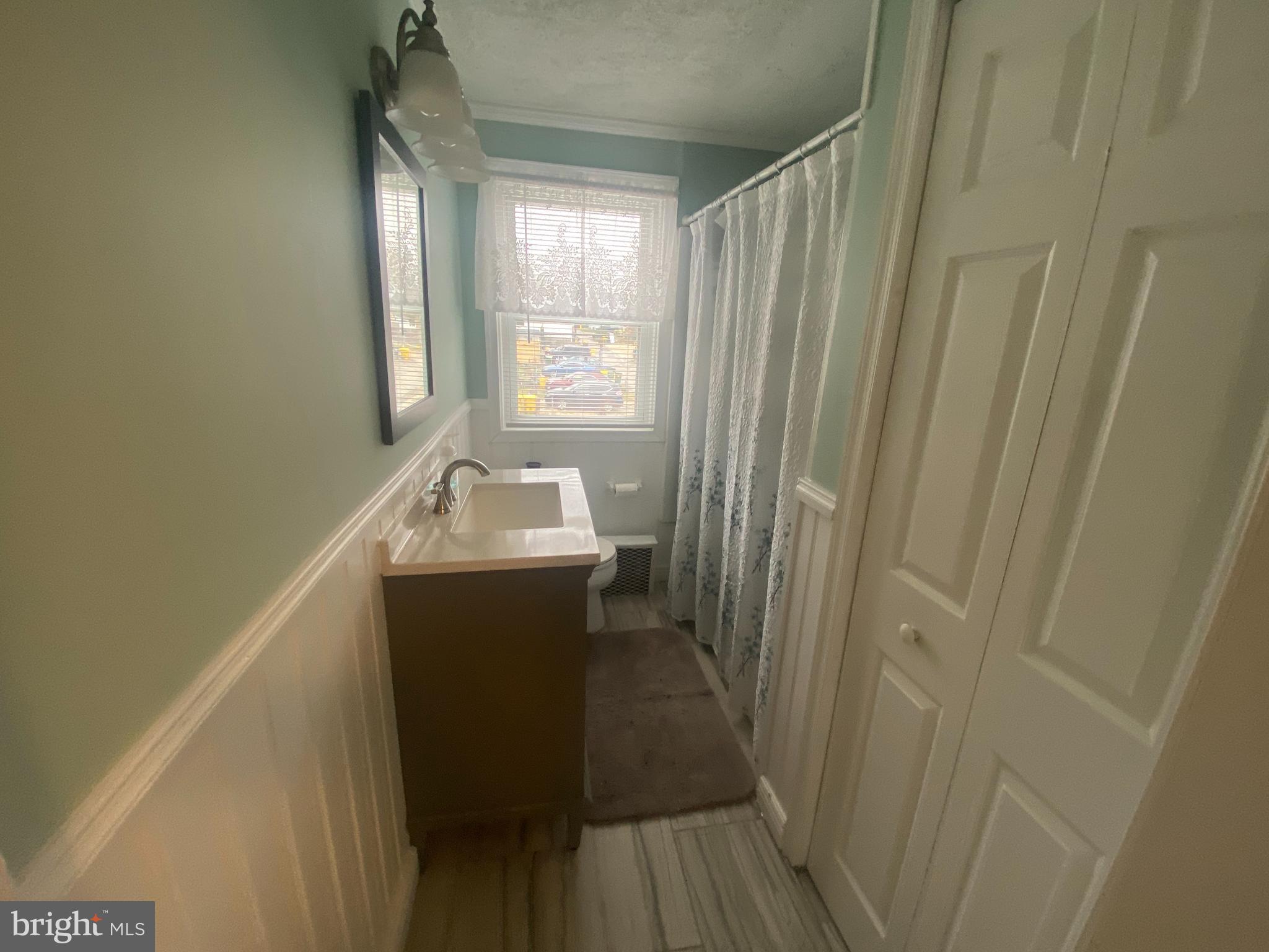 409 Old Riverside Road Brooklyn, MD 21225 - Photo 13 of 34 New bathroom w/Wainscott