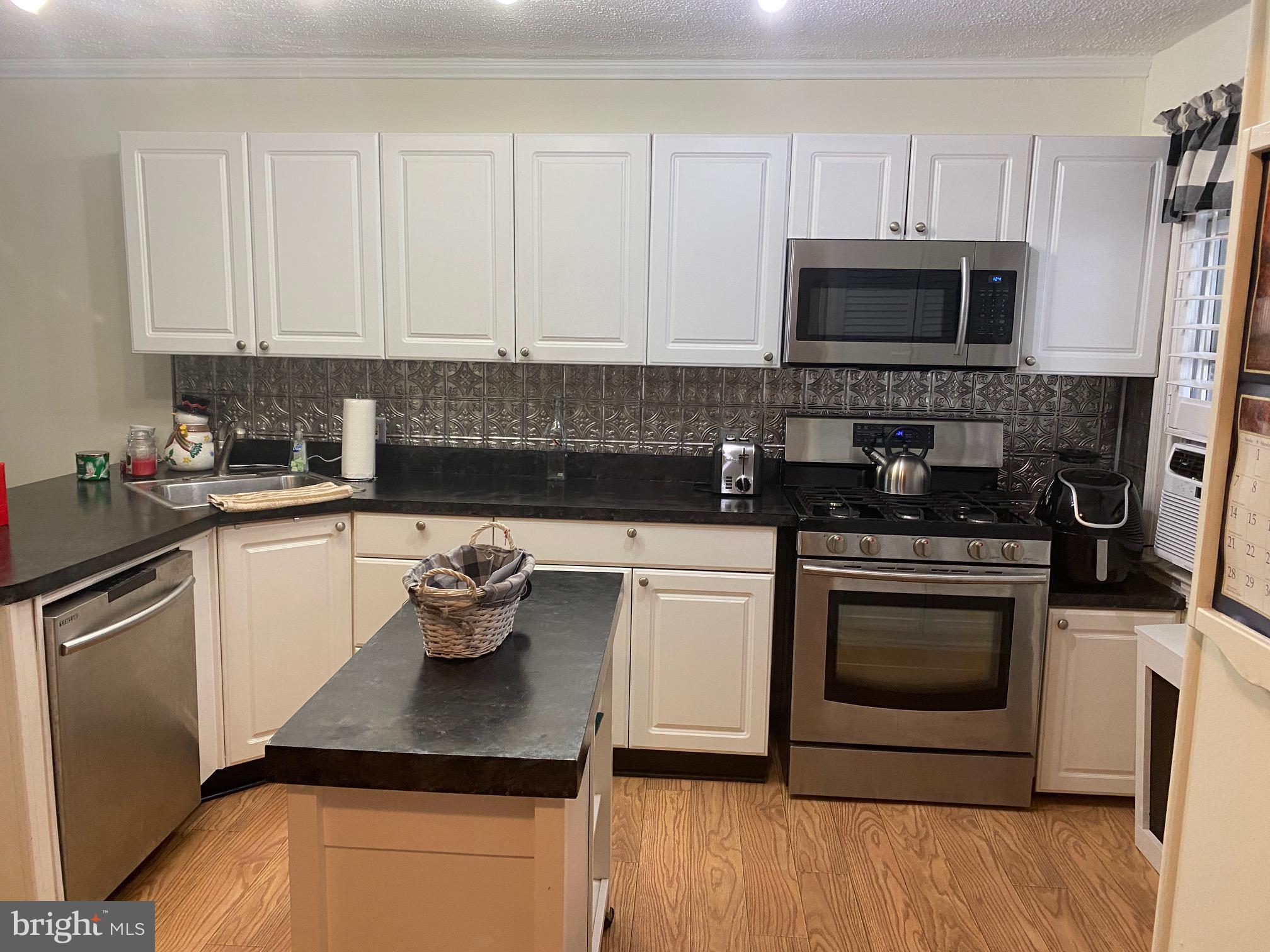 409 Old Riverside Road Brooklyn, MD 21225 - Photo 5 of 34 Kitchen 5 burner gas stove, D/W, Island