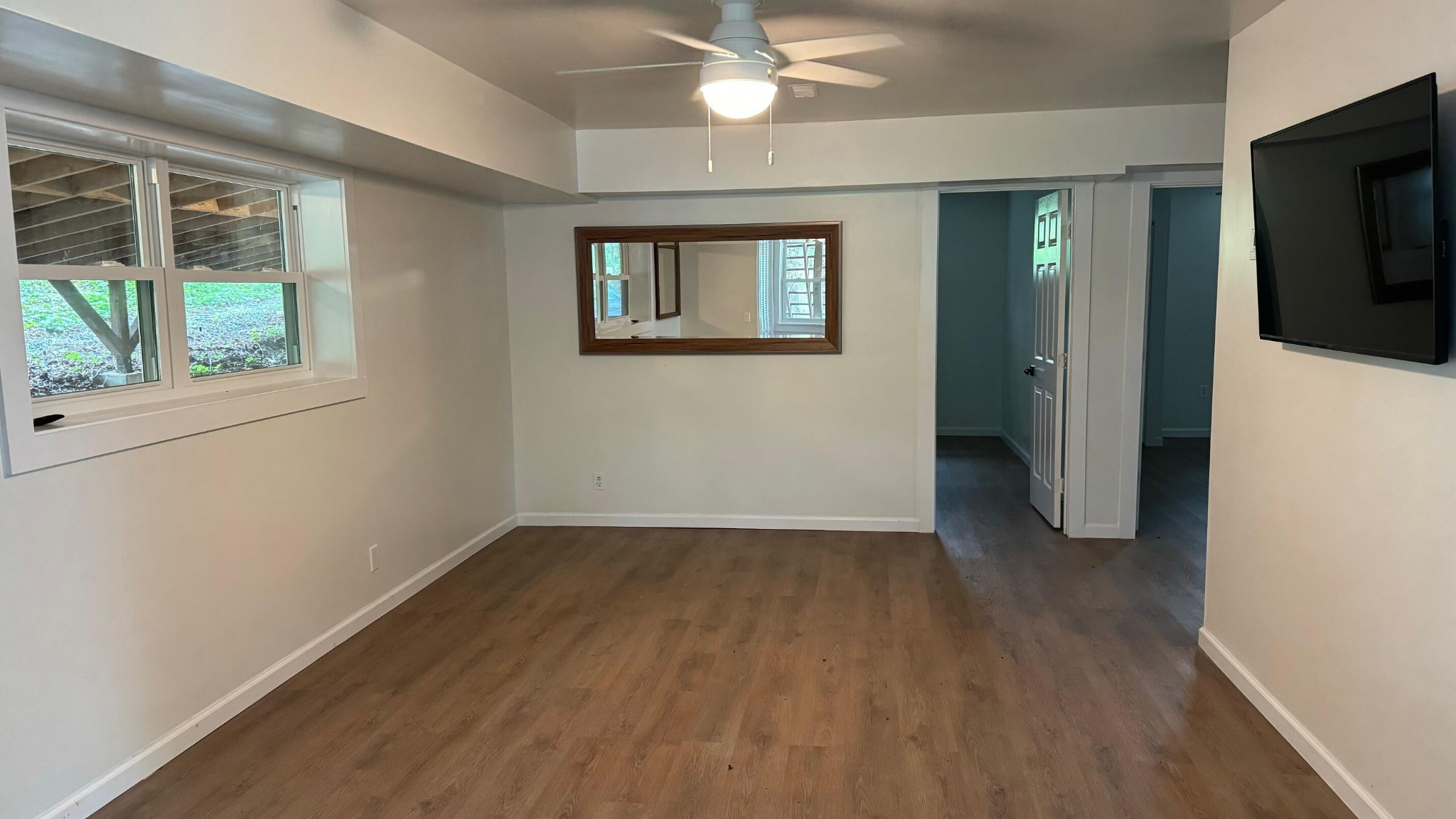 340 Grady Road Etowah, TN 37331 - Photo 11 of 34 an empty room with wooden floor and windows