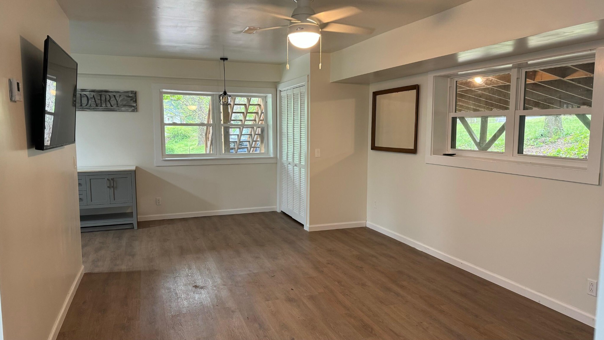 340 Grady Road Etowah, TN 37331 - Photo 12 of 34 an empty room with wooden floor and windows