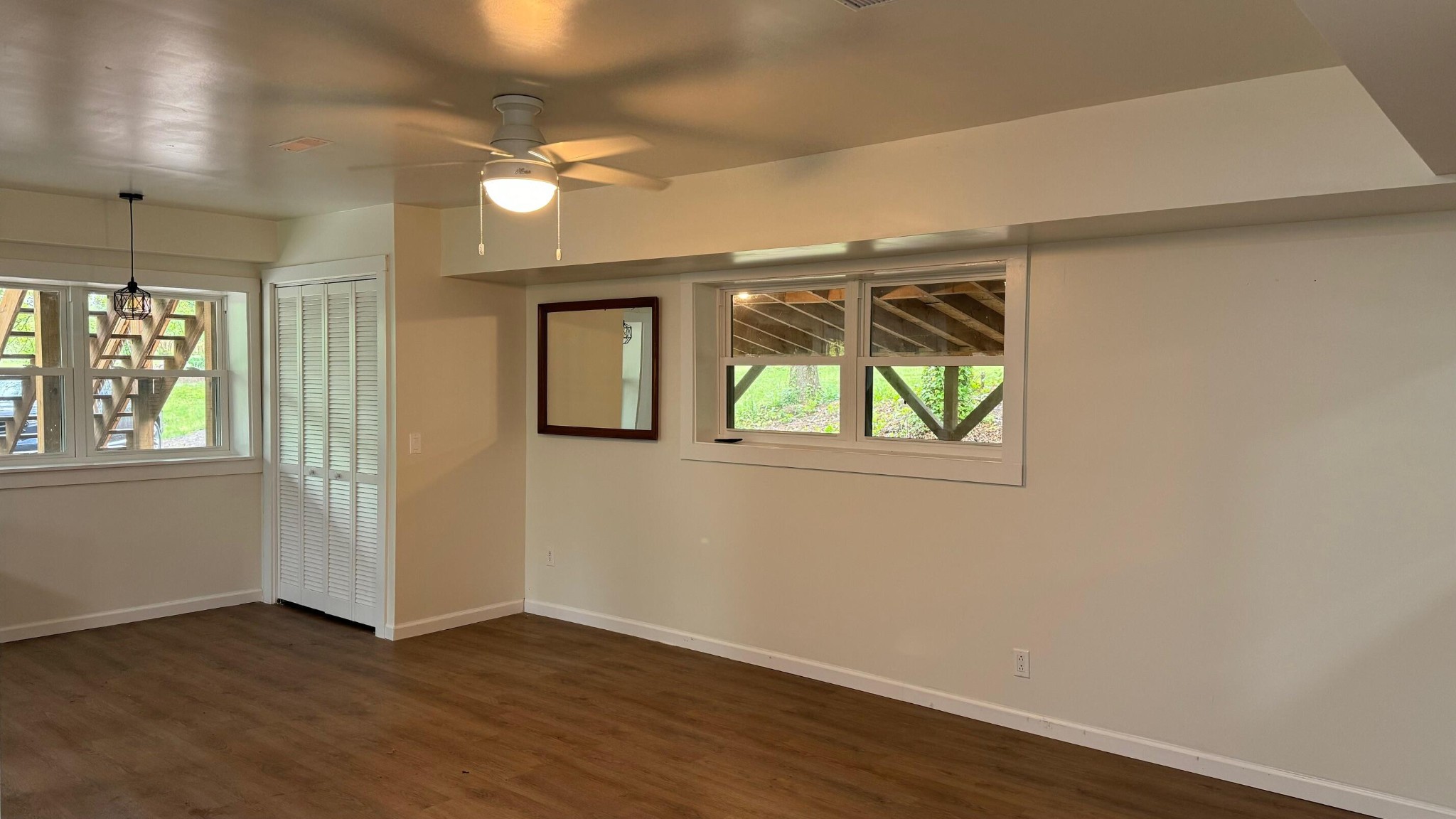 340 Grady Road Etowah, TN 37331 - Photo 13 of 34 an empty room with wooden floor and windows