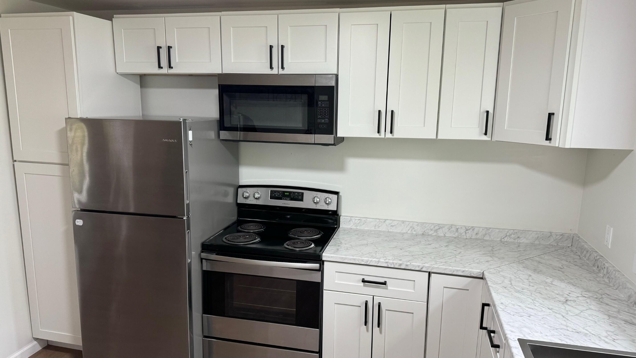 340 Grady Road Etowah, TN 37331 - Photo 15 of 34 a kitchen with stainless steel appliances white cabinets and a refrigerator