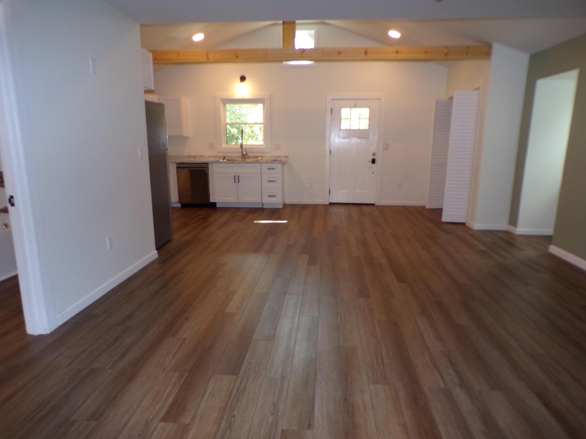 340 Grady Road Etowah, TN 37331 - Photo 23 of 34 an empty room with wooden floor and windows