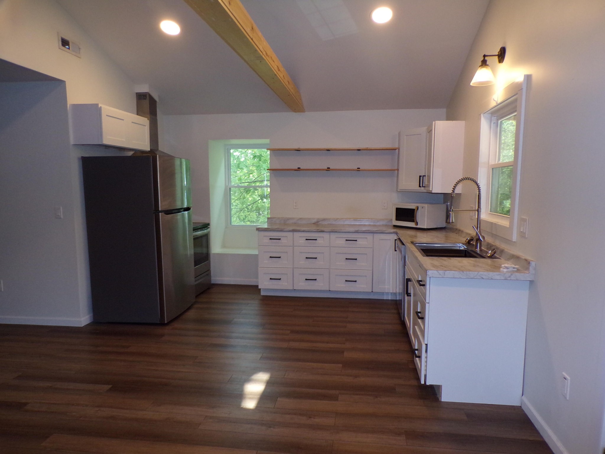 340 Grady Road Etowah, TN 37331 - Photo 27 of 34 a kitchen with granite countertop a refrigerator and a stove top oven