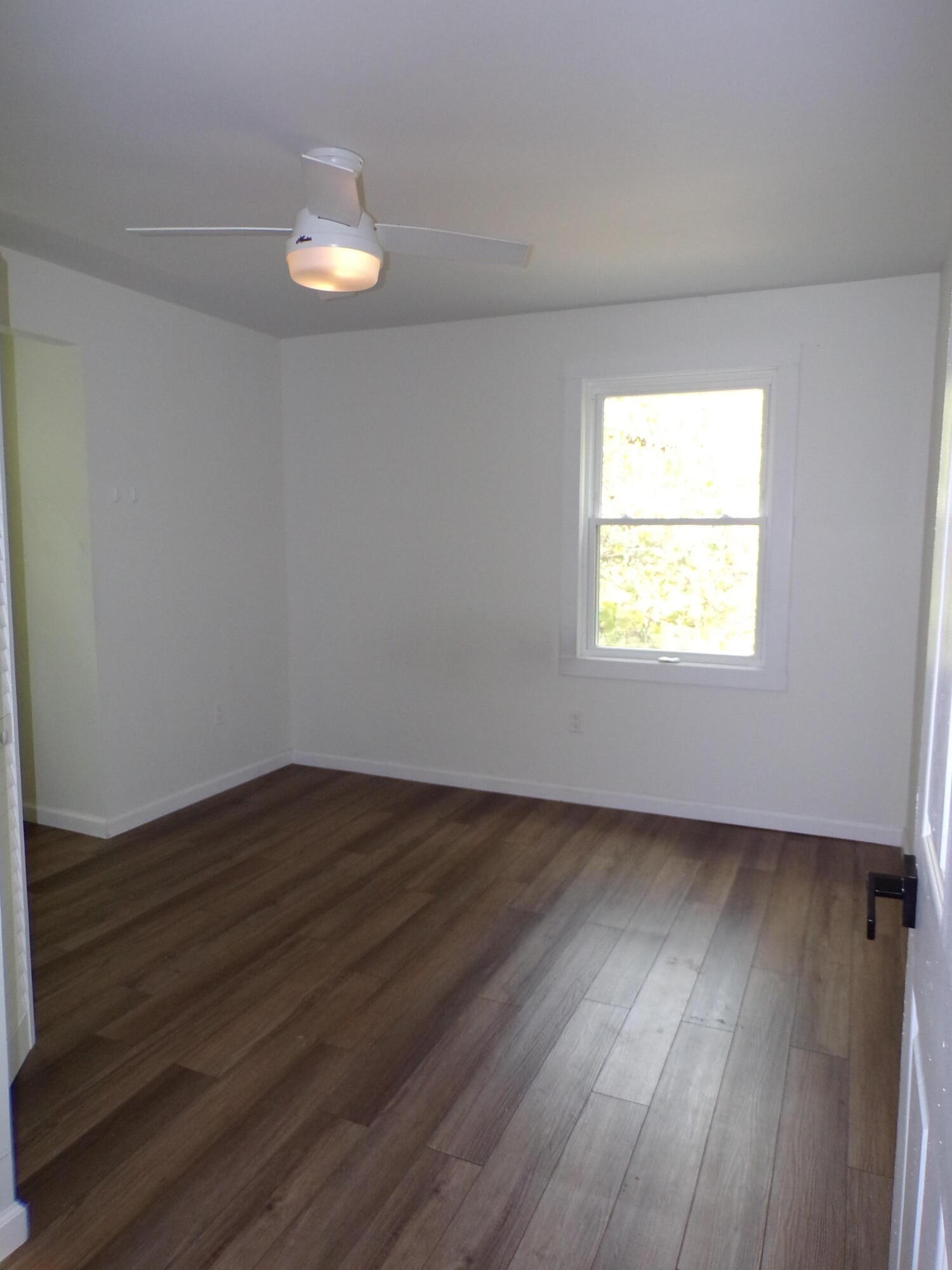 340 Grady Road Etowah, TN 37331 - Photo 34 of 34 a view of an empty room with wooden floor and a window
