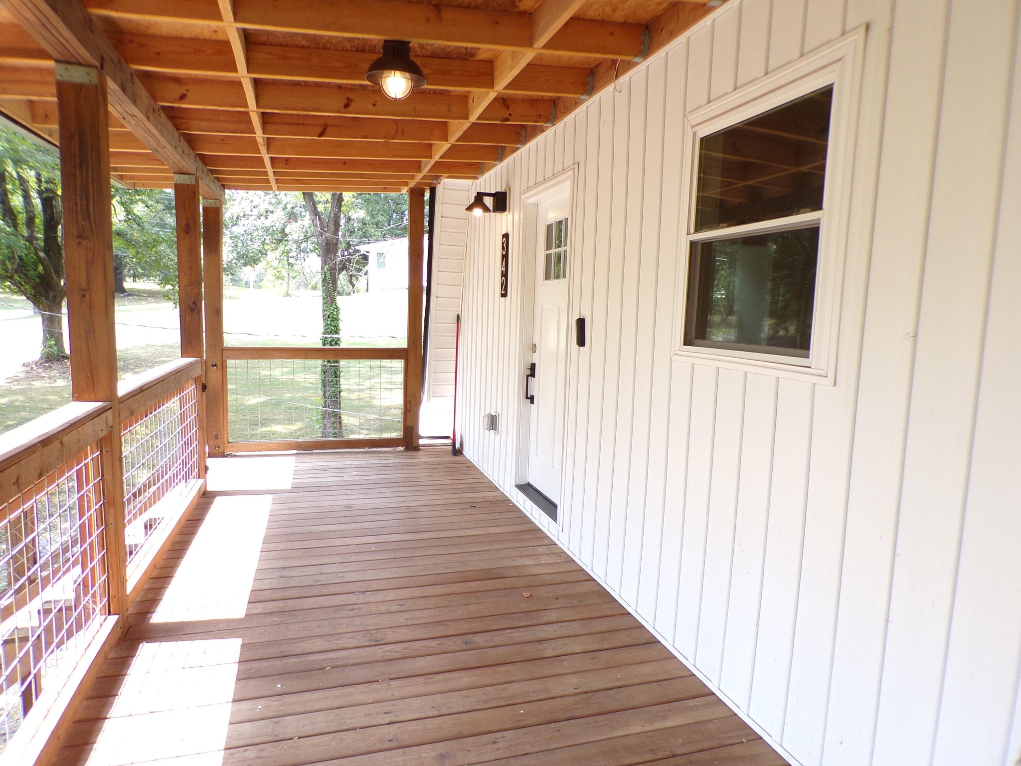340 Grady Road Etowah, TN 37331 - Photo 5 of 34 a view of a porch with wooden floor and windows