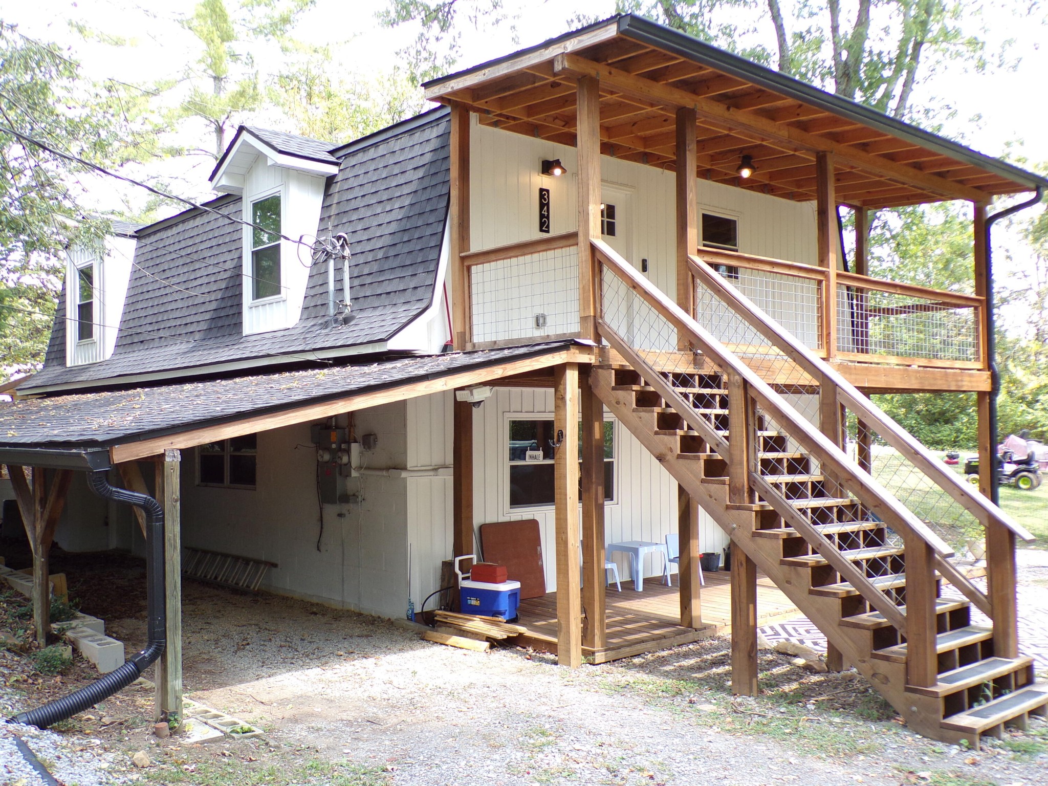340 Grady Road Etowah, TN 37331 - Photo 6 of 34 a view of a house with large windows and wooden fence