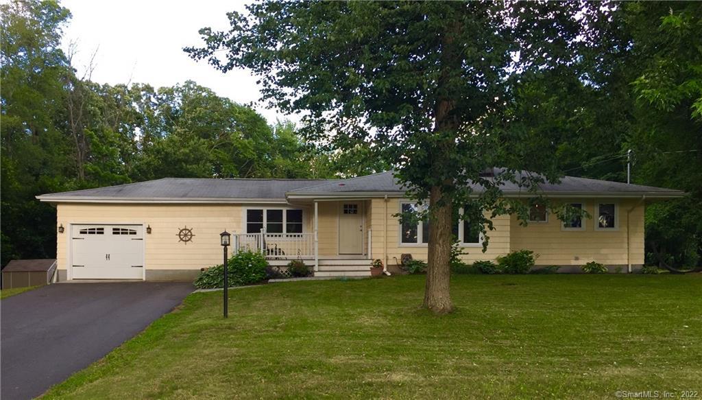 a view of a house with a yard