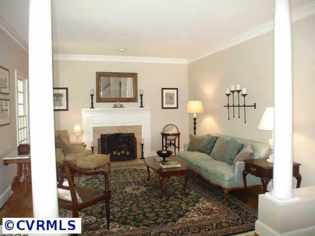 12005 Reeds Bluff Lane Midlothian, VA 23113 - Photo 4 of 10 a living room with furniture and a fireplace