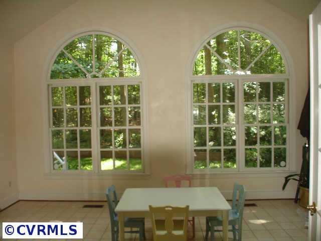 12005 Reeds Bluff Lane Midlothian, VA 23113 - Photo 9 of 10 a view of a large window with a lot of windows
